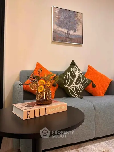 Stylish living room with modern sofa, vibrant cushions, and elegant decor