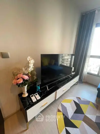 Modern living room with stylish TV stand and large window view