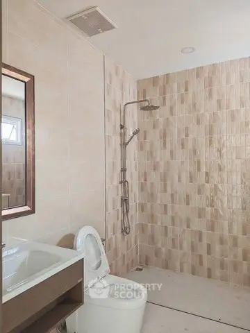 Modern bathroom with sleek shower and elegant tile design