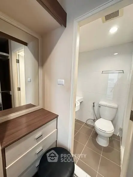 Modern bathroom with vanity and toilet in compact space