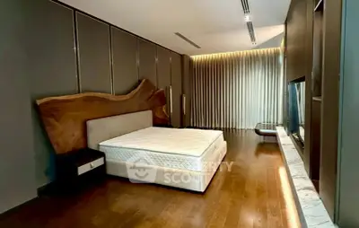 Luxurious bedroom with unique wood accent wall and elegant lighting