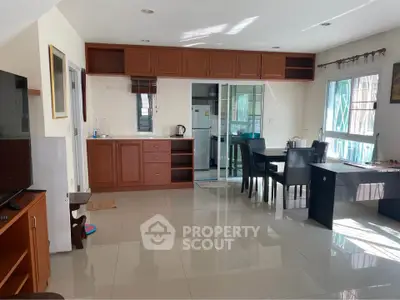 Spacious open-plan living area with modern kitchen and dining space.