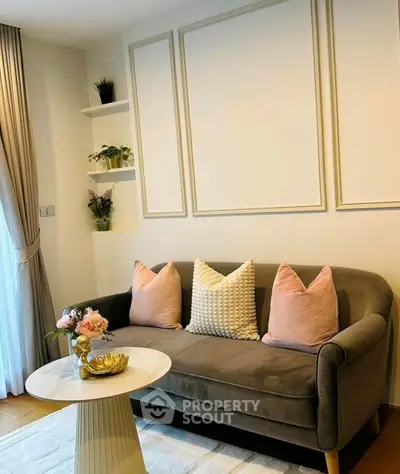 Chic living room with stylish sofa, elegant decor, and natural light for a cozy ambiance.