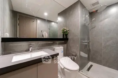 Modern bathroom with sleek design and glass shower enclosure