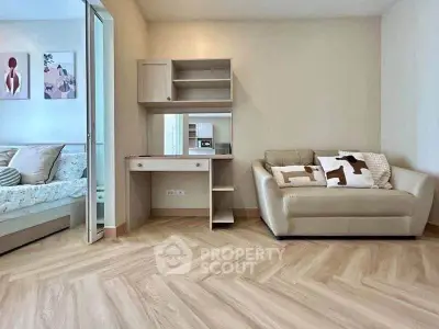 Modern living room with stylish decor and cozy seating area, perfect for relaxation.