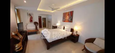 Spacious modern bedroom with elegant decor and ambient lighting