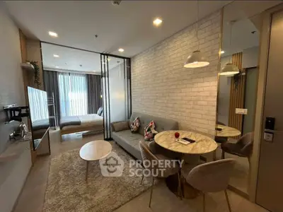 Modern open-plan living room with cozy seating and dining area