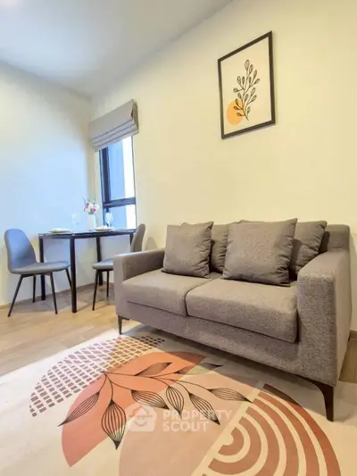 Stylish modern living room with cozy sofa and dining area