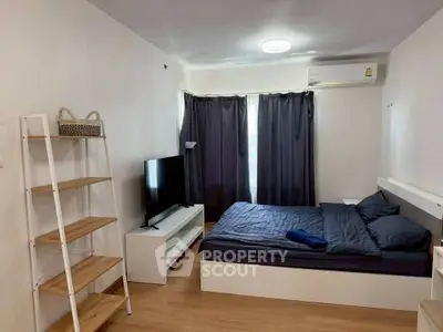 Modern bedroom with sleek furniture and natural light, perfect for urban living.