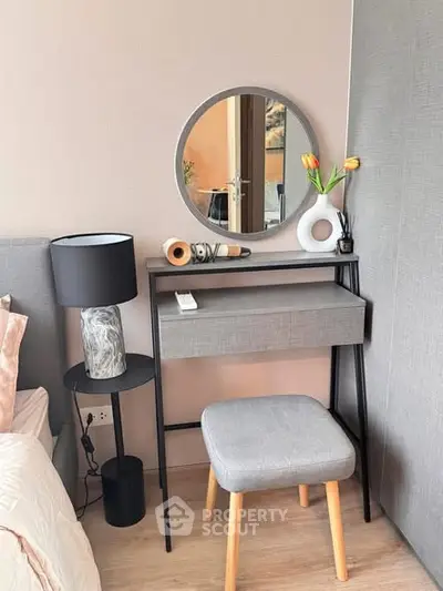Stylish bedroom corner with modern vanity and elegant decor