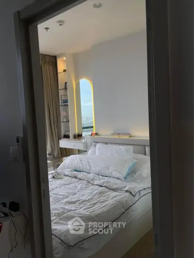 Cozy bedroom with modern decor and city view window