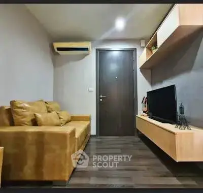 Modern living room with stylish sofa and wall-mounted TV unit