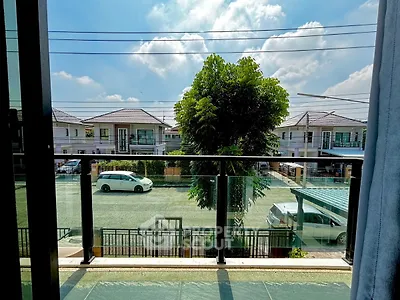 Scenic balcony view with modern houses and clear blue sky