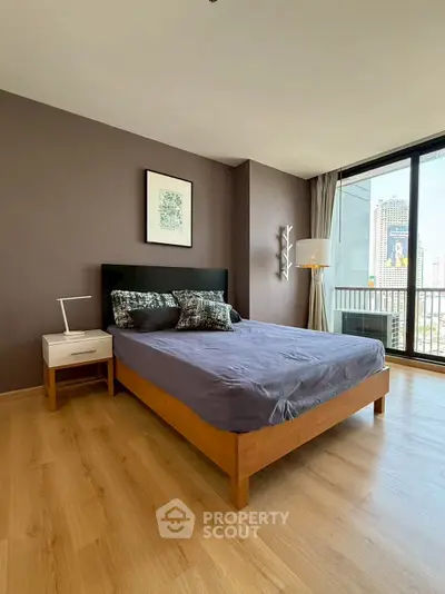 Modern bedroom with city view and stylish decor in high-rise apartment