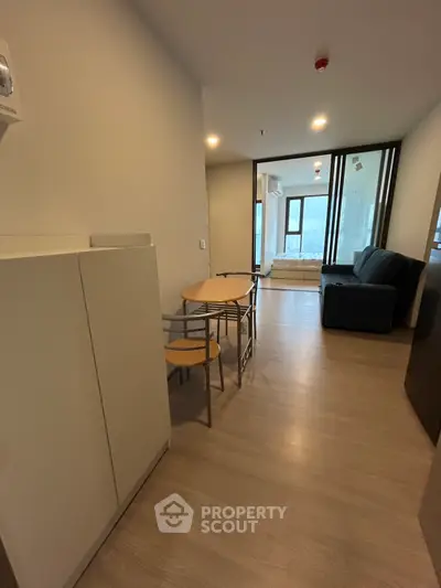 Modern living room with sleek furniture and large windows offering a stunning view.