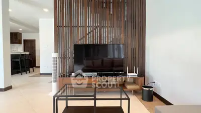 Modern living room with sleek TV setup and stylish wooden accents