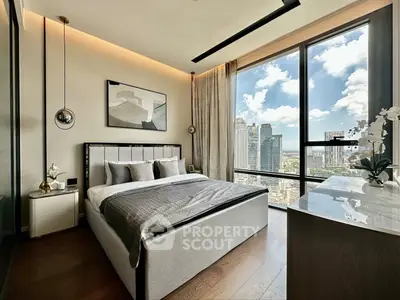 Luxurious bedroom with stunning city view and modern decor