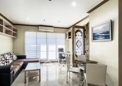 Bright and spacious living room with modern furniture and large windows.