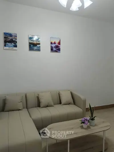 Modern living room with beige sofa and minimalist decor