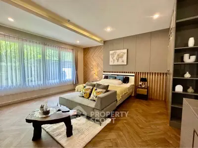 Luxurious bedroom with modern decor and large window view