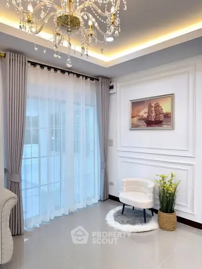 Elegant living room corner with chandelier and stylish decor