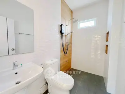 Modern bathroom with sleek fixtures and white tile design