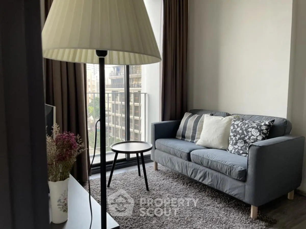 Cozy living room with modern sofa and city view from window