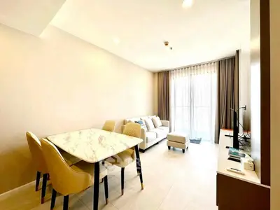 Spacious and bright living room with elegant dining area and modern decor.