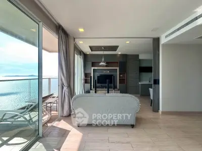 Luxurious living room with stunning sea view and spacious balcony, perfect for relaxation.