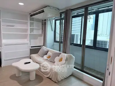 Modern living room with cozy sofa and large windows offering city views