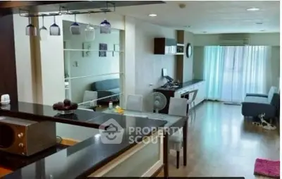 Spacious modern living room with open kitchen and stylish decor