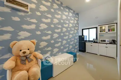 Charming kitchen with cloud-themed wall and modern appliances