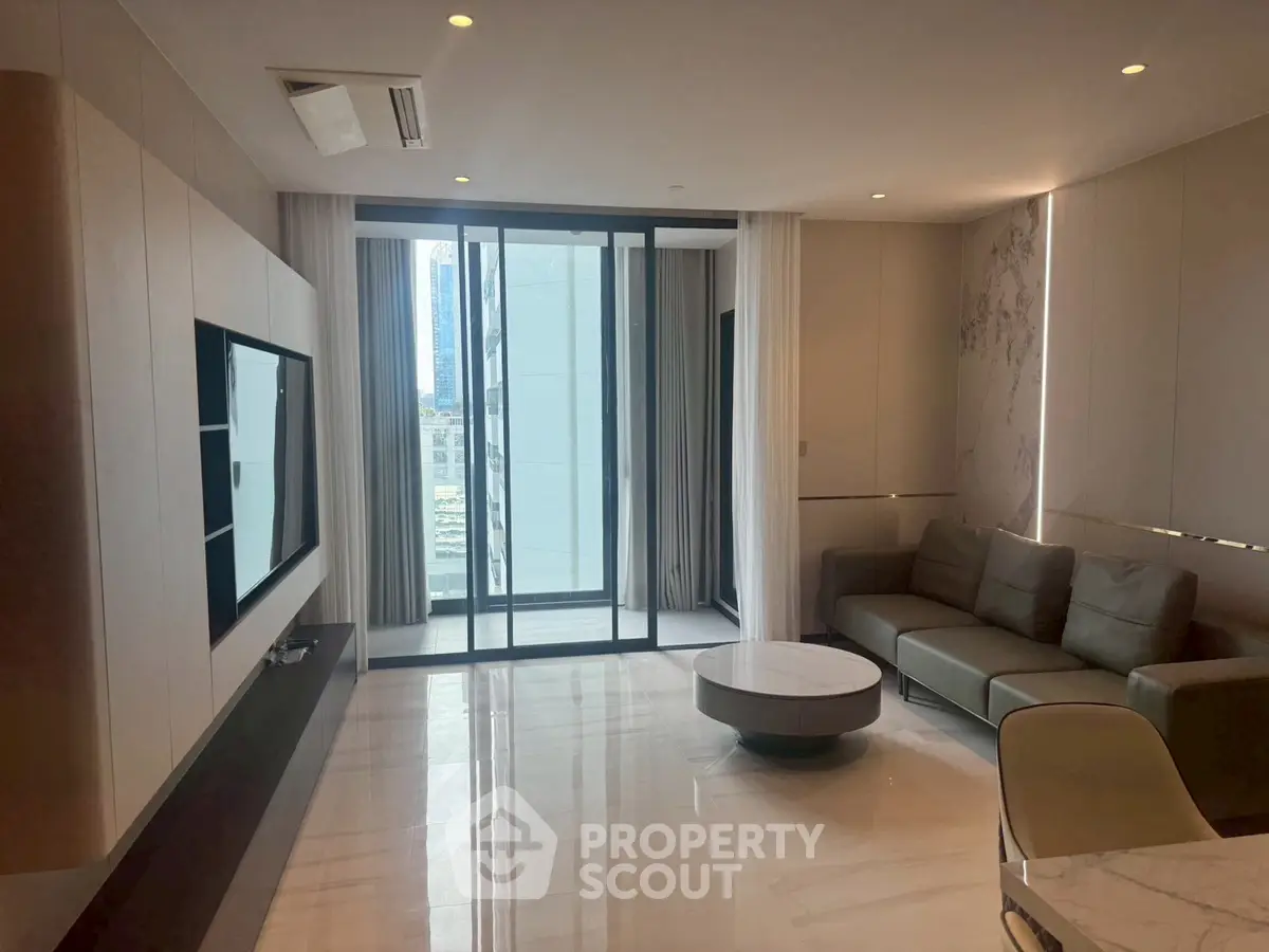 Modern living room with sleek design and city view balcony access.