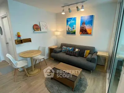 Modern living room with stylish decor and cozy seating area, perfect for relaxation and entertaining.