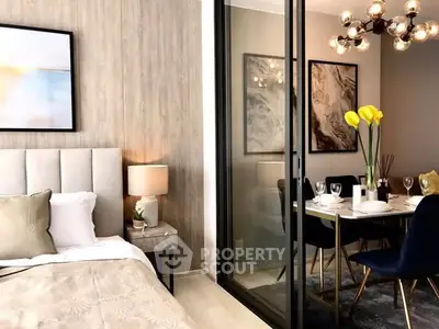Elegant bedroom with modern dining area, stylish decor and ambient lighting.