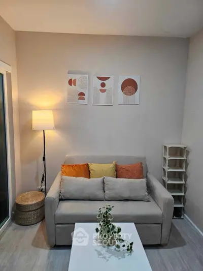 Cozy living room with modern decor and comfortable seating, perfect for relaxation.