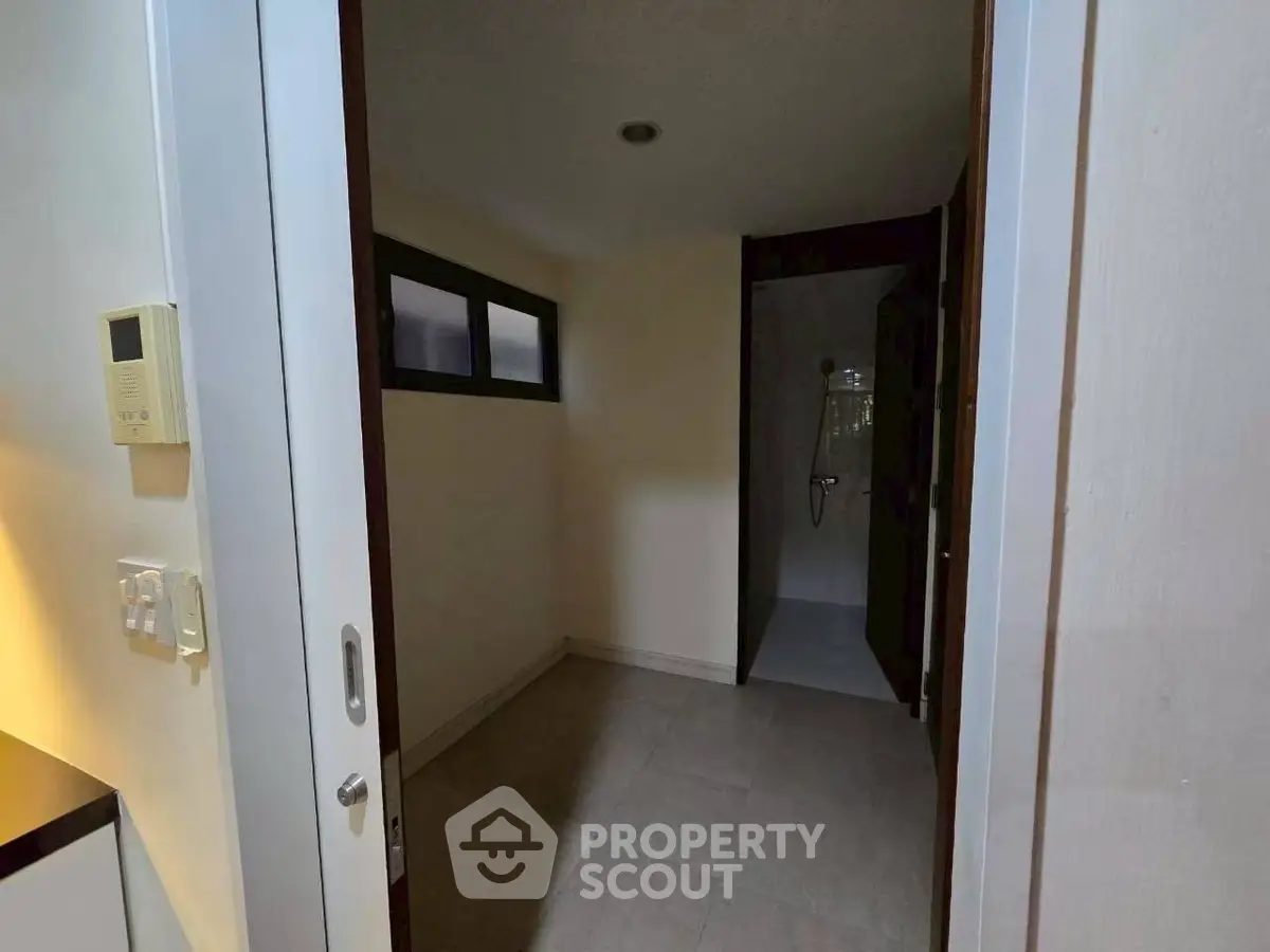 Compact bathroom with shower and modern fixtures in cozy apartment