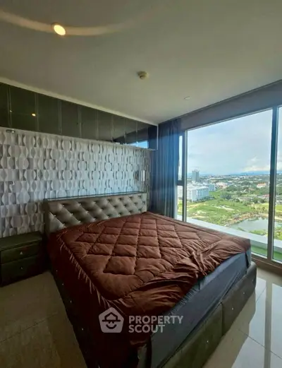 Luxurious bedroom with stunning city view and modern decor