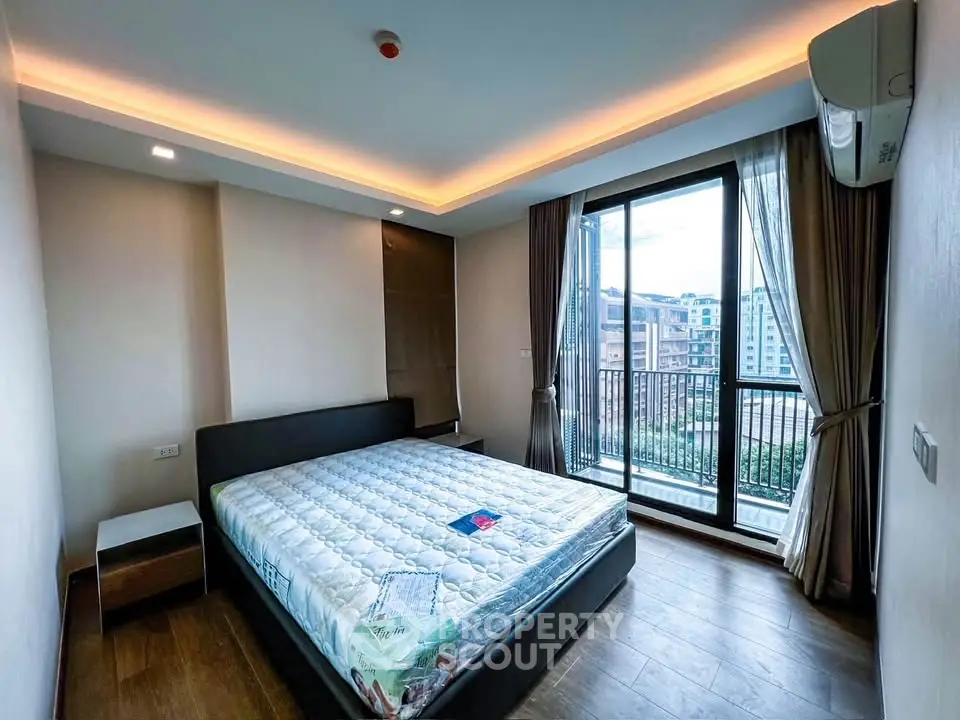 Modern bedroom with balcony view in urban apartment
