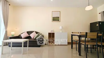 Spacious living room with modern furniture and dining area