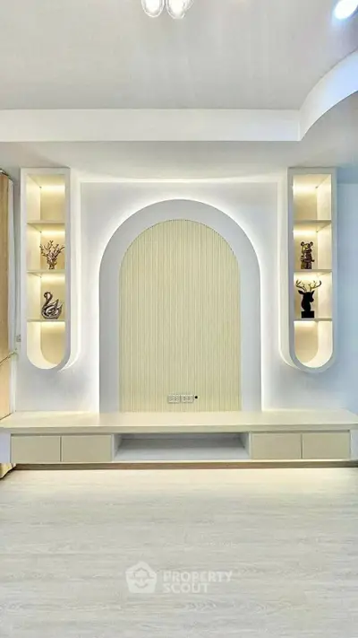 Modern living room with elegant built-in shelves and ambient lighting