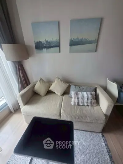 Cozy living room with modern sofa and stylish decor, perfect for relaxation and entertaining.