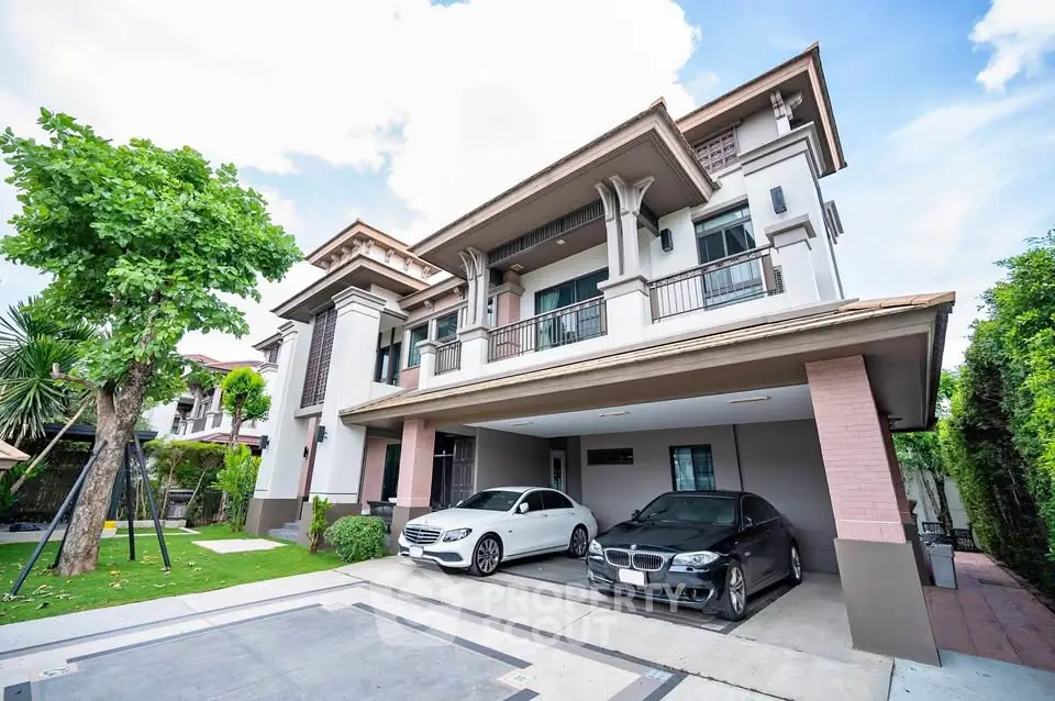 Luxurious modern house with spacious driveway and elegant architecture in a serene neighborhood.
