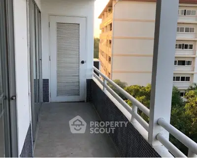Spacious balcony with scenic view in modern apartment building