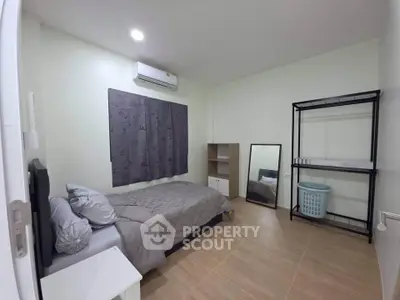 Cozy bedroom with modern decor and ample storage space