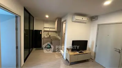 Modern apartment interior with open kitchen and cozy living area