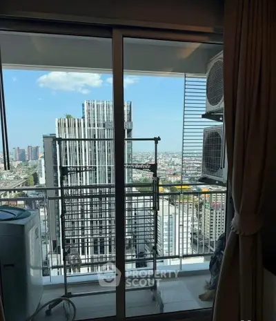 High-rise balcony with cityscape view and air conditioning units
