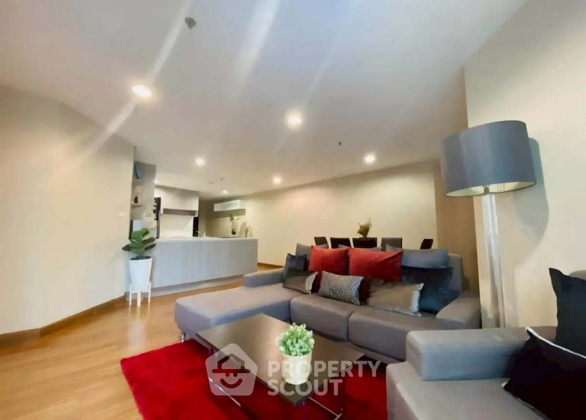 Spacious modern living room with stylish decor and open kitchen layout