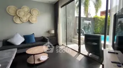 Luxurious living room with pool view and modern decor