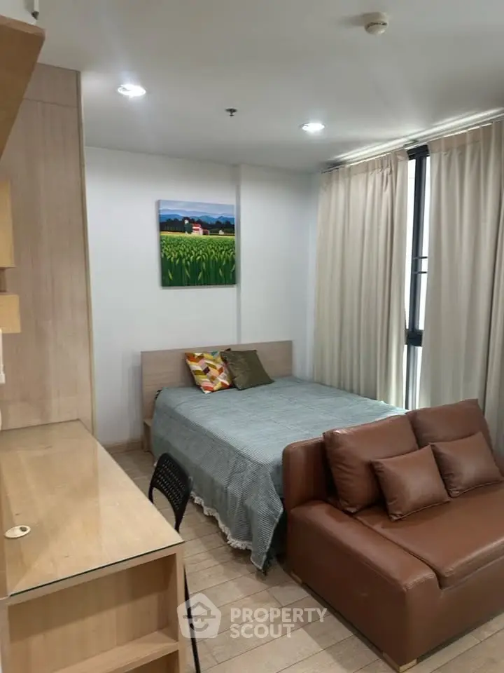 Cozy bedroom with modern decor and natural light in urban apartment